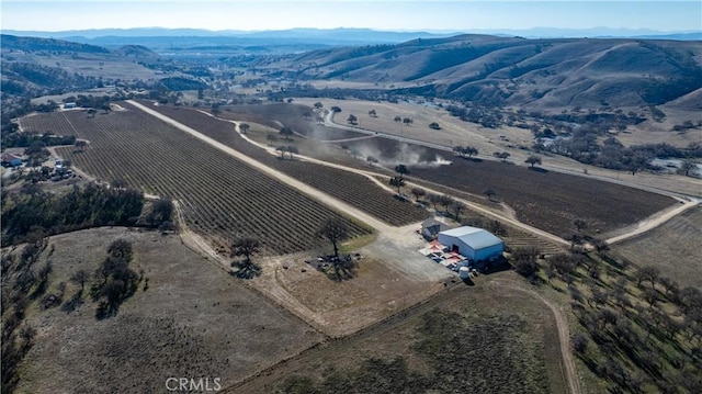 aerial view with a mountain view and a rural view