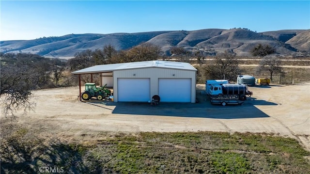 exterior space with a mountain view and a carport