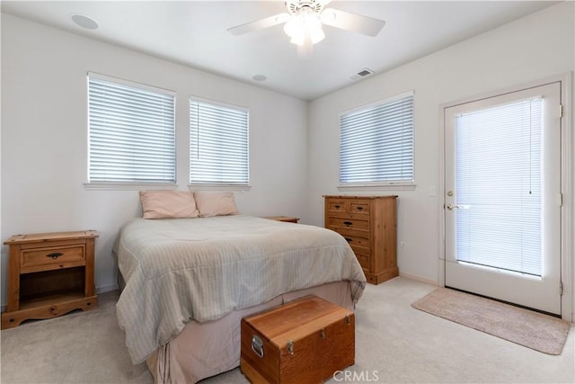 bedroom with ceiling fan and light colored carpet