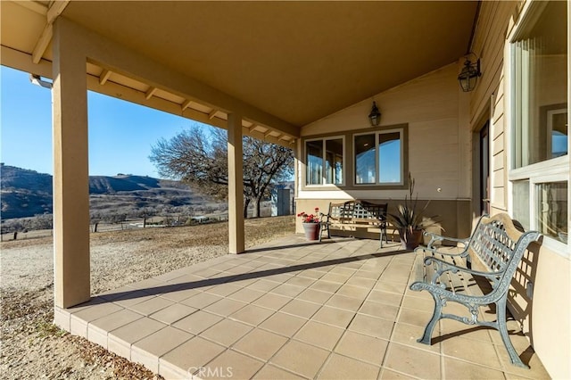 view of patio / terrace with a mountain view