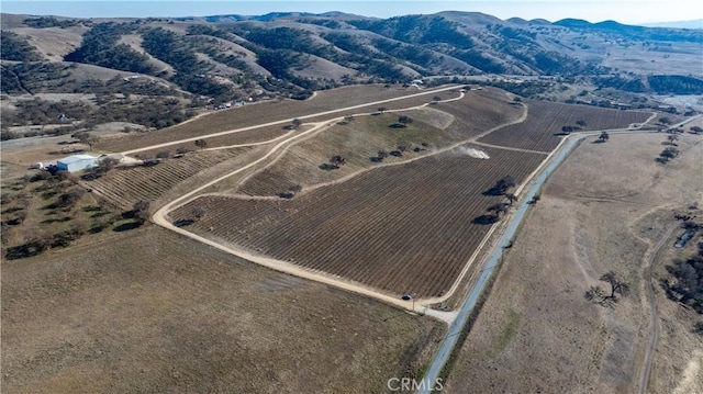 drone / aerial view with a mountain view and a rural view