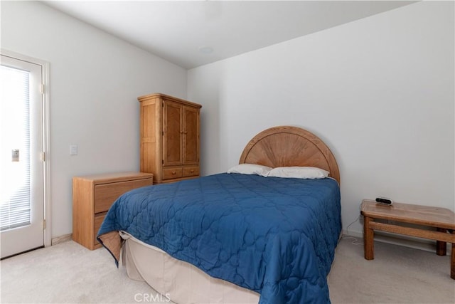 bedroom featuring light colored carpet