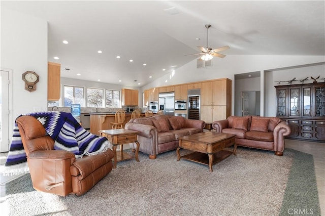 living room featuring high vaulted ceiling and ceiling fan