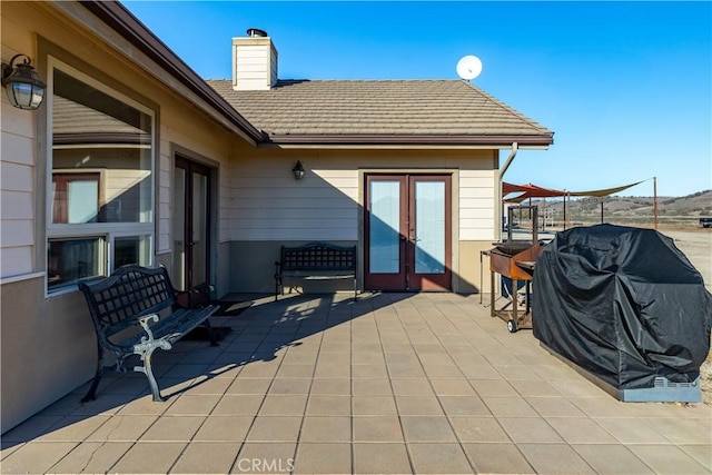 view of patio / terrace with area for grilling and french doors