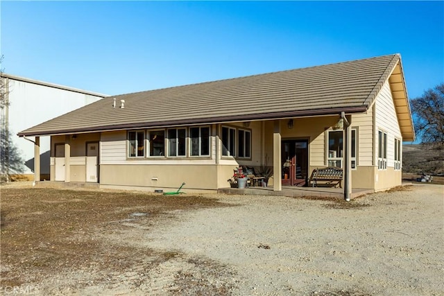 back of house with a patio