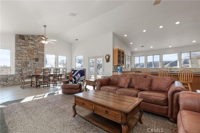 living room with french doors, ceiling fan, high vaulted ceiling, and light tile patterned floors