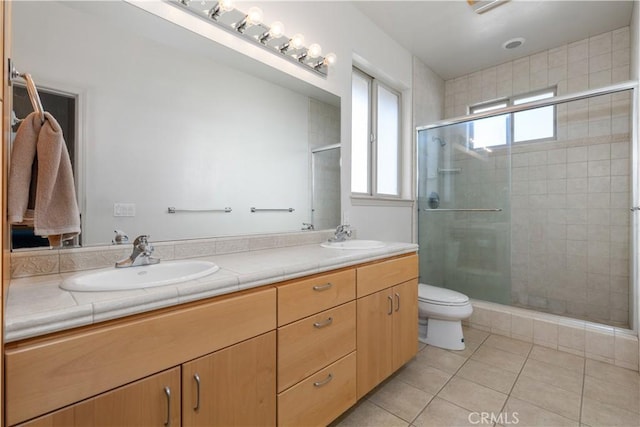 bathroom featuring vanity, an enclosed shower, tile patterned floors, and toilet