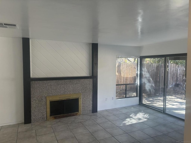 unfurnished living room featuring tile patterned floors