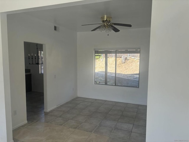 unfurnished room with ceiling fan