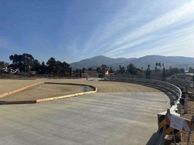 view of street with a mountain view and a rural view