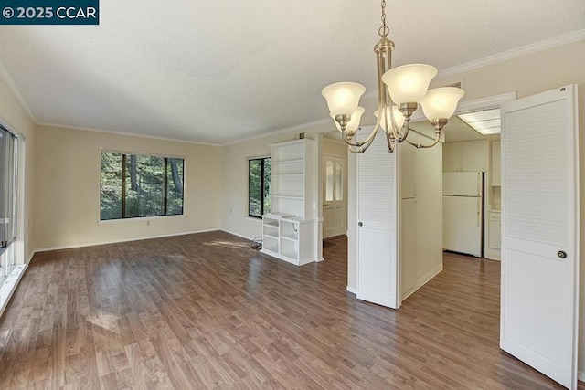 interior space with ornamental molding and dark hardwood / wood-style flooring