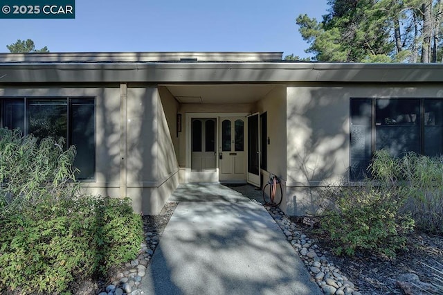 doorway to property featuring a patio