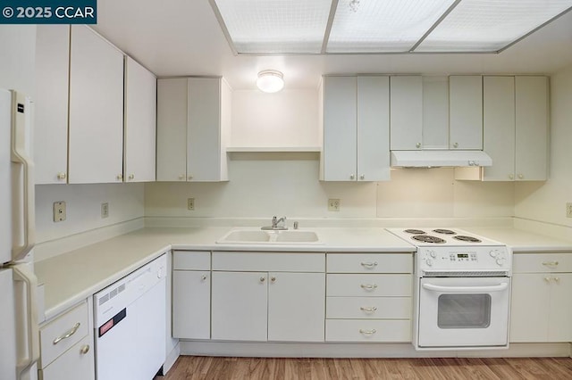 kitchen featuring sink, white cabinets, white appliances, and light wood-type flooring