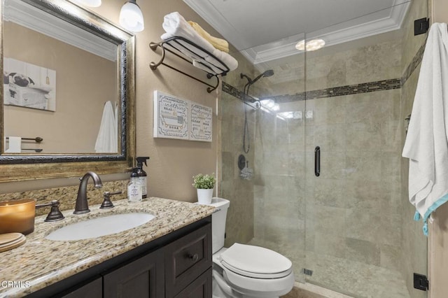 bathroom featuring a shower with door, ornamental molding, vanity, and toilet