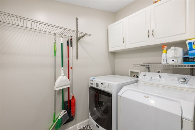 laundry room with cabinets and independent washer and dryer