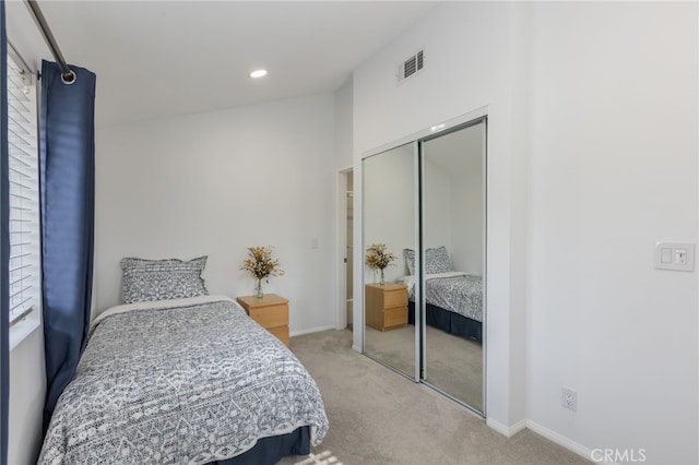 bedroom featuring carpet floors and a closet