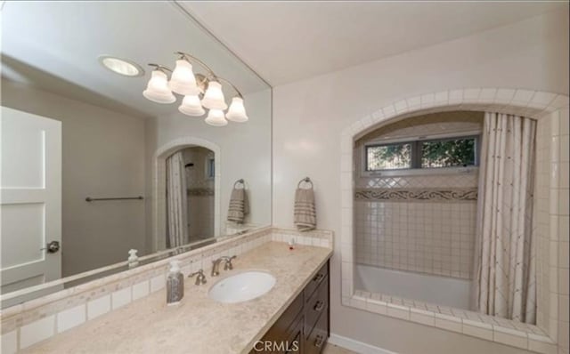 bathroom with vanity and an inviting chandelier