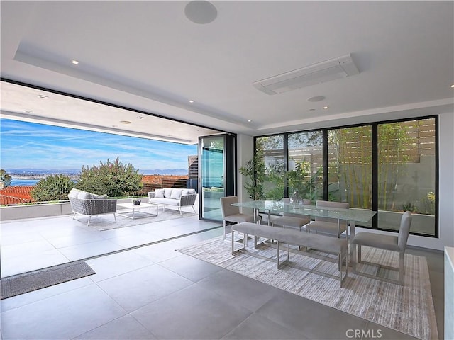 interior space featuring an outdoor hangout area and a water view