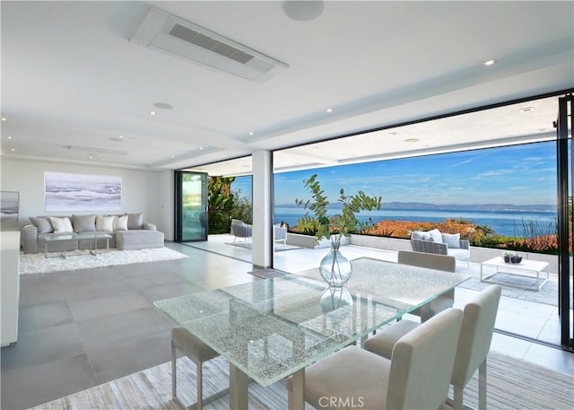 dining room featuring a water view