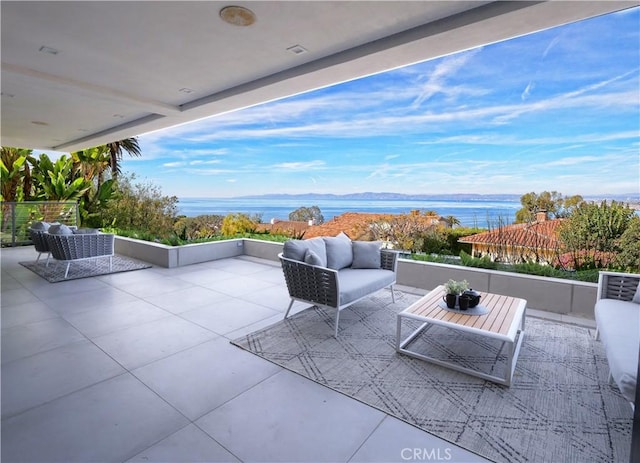 view of patio / terrace featuring a water view and an outdoor hangout area