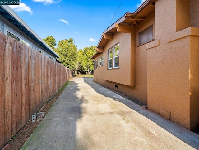 view of side of property with a patio