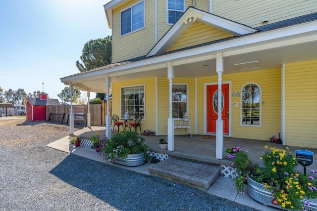 property entrance with covered porch