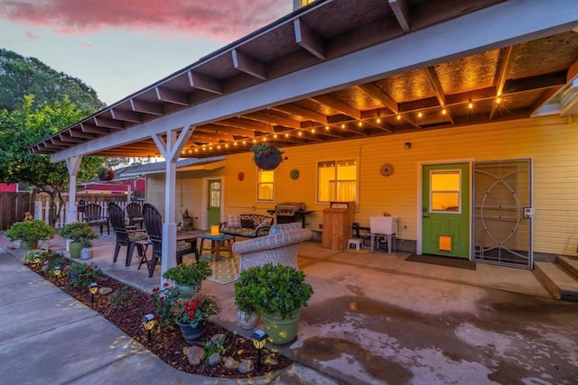 patio terrace at dusk with outdoor lounge area