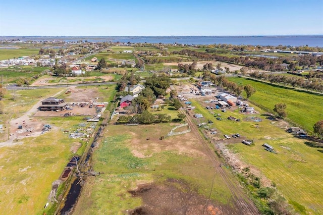 aerial view with a water view and a rural view