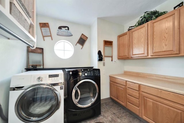 laundry area with cabinets, light tile patterned floors, and independent washer and dryer