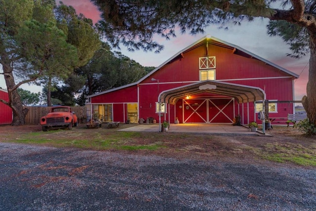 outdoor structure at dusk with a carport