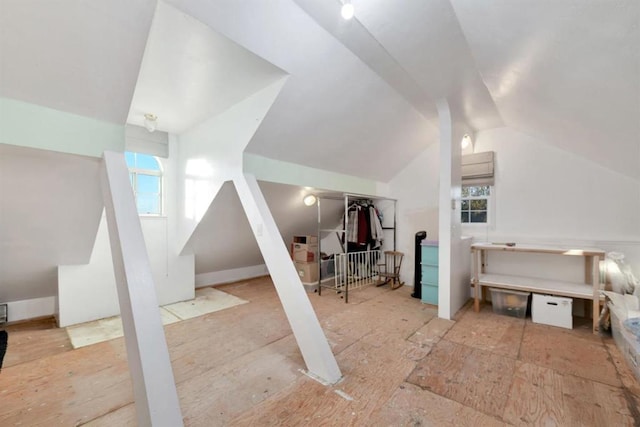 bonus room featuring lofted ceiling