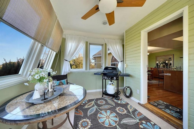 sunroom / solarium with ceiling fan