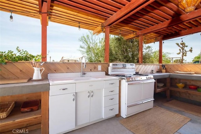 view of patio / terrace with sink and an outdoor kitchen