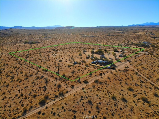 drone / aerial view featuring a mountain view