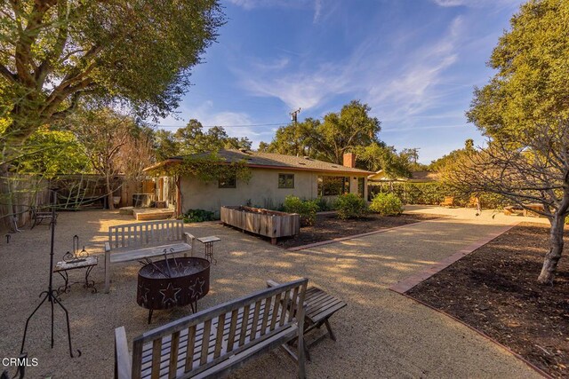 view of patio with a fire pit