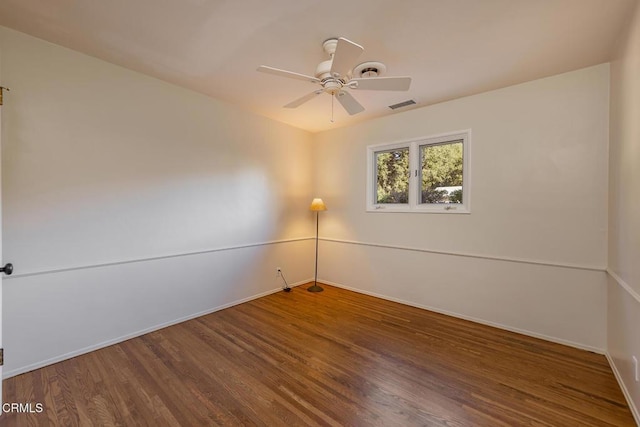 empty room with ceiling fan and hardwood / wood-style floors