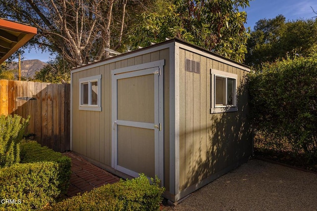 view of outbuilding featuring a mountain view