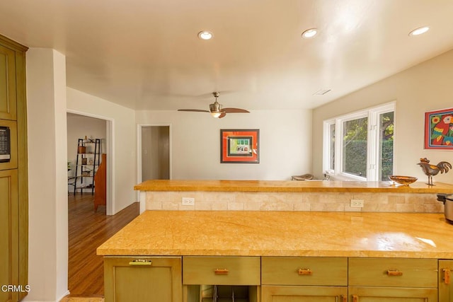 kitchen featuring butcher block counters, hardwood / wood-style floors, and ceiling fan