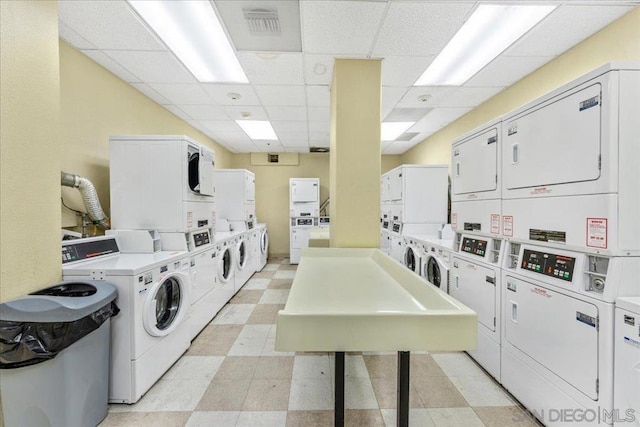 laundry area with washing machine and clothes dryer and stacked washer and clothes dryer