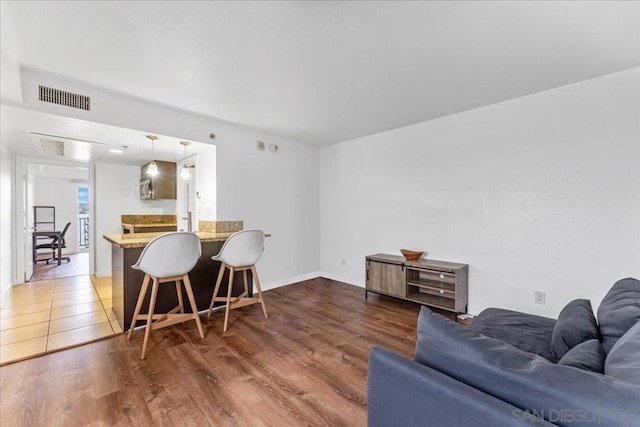 living room featuring dark wood-type flooring