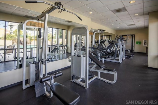 gym featuring a drop ceiling