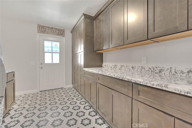 kitchen featuring light stone countertops