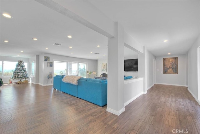 living room with dark hardwood / wood-style flooring