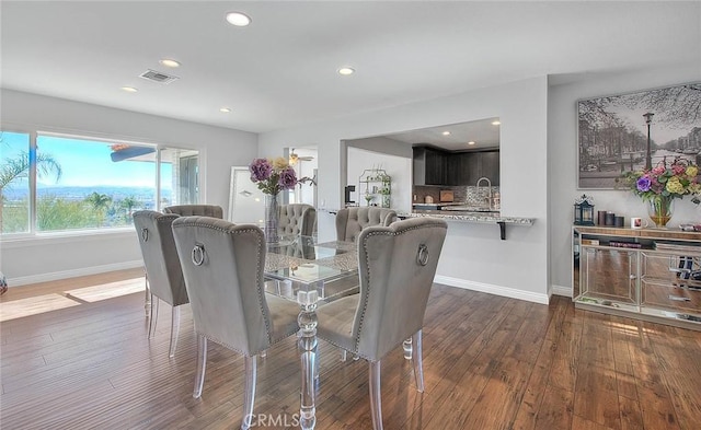 dining area with dark wood-type flooring