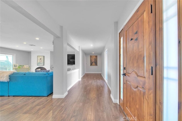 hall featuring wood-type flooring