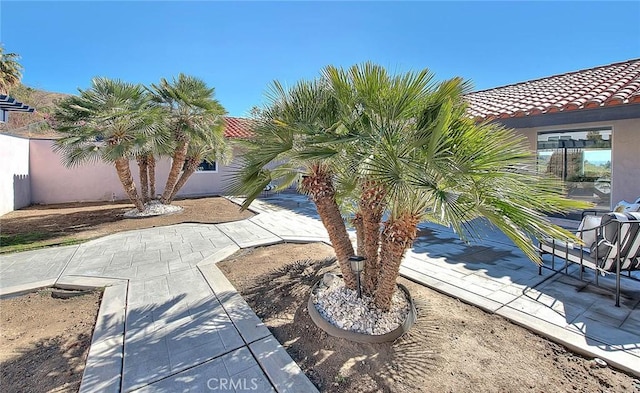 view of property exterior featuring a patio area