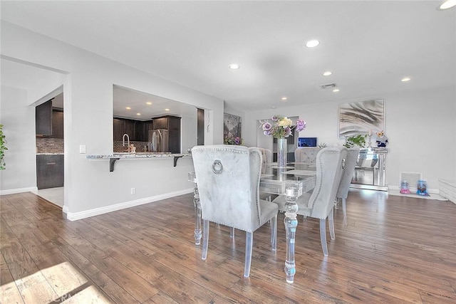 dining area featuring wood-type flooring