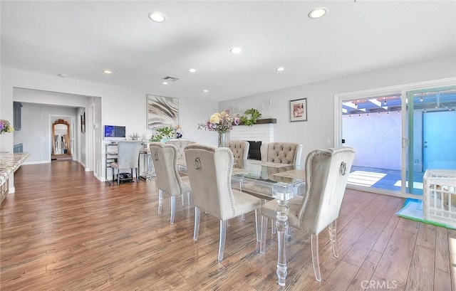 dining area with hardwood / wood-style floors