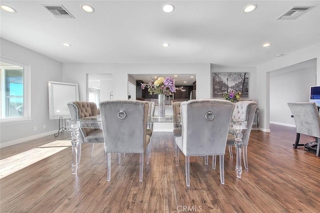 dining area featuring wood-type flooring