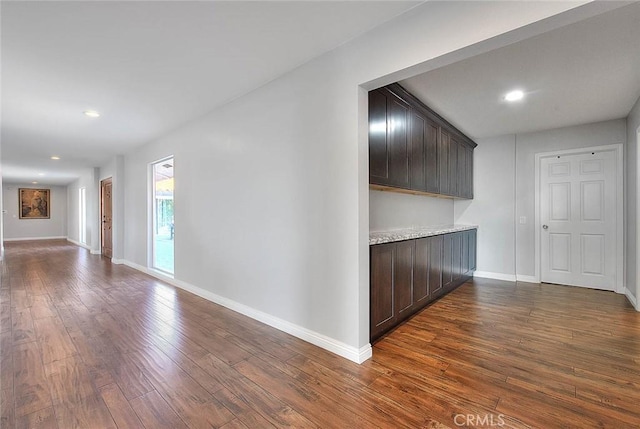 hall with dark hardwood / wood-style floors